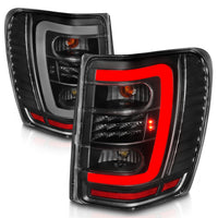 ANZO 1999-2004 Jeep Grand Cherokee LED Tail Lights w/ Light Bar Black Housing Clear Lens - Burkken Auto Parts