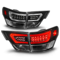 ANZO 11-13 Jeep Grand Cherokee LED Taillights w/ Lightbar Black Housing/Clear Lens 4pcs - Burkken Auto Parts