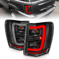 ANZO 1999-2004 Jeep Grand Cherokee LED Tail Lights w/ Light Bar Black Housing Clear Lens - Burkken Auto Parts