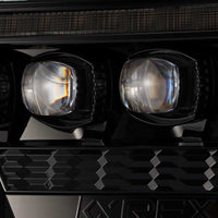 AlphaRex 12-15 Toyota Tacoma NOVA LED Proj Headlights Plank Alpha Blk w/Activ Light/Seq Signal/DRL - Burkken Auto Parts