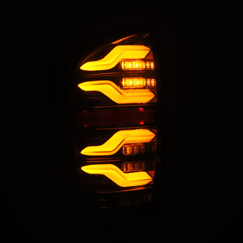 AlphaRex 16-21 Toyota Tacoma LUXX LED Taillights Alpha Blk w/Activ Light/Seq Signal - Burkken Auto Parts