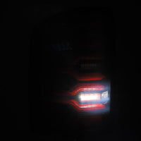 AlphaRex 14-18 GMC Sierra 1500/2500HD/3500HD LUXX-Series LED Tail Lights Blk/Red w/Actv Lgt Seq. Sig - Burkken Auto Parts