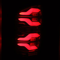 AlphaRex 16-21 Toyota Tacoma LUXX LED Taillights Blk/Red w/Activ Light/Seq Signal - Burkken Auto Parts