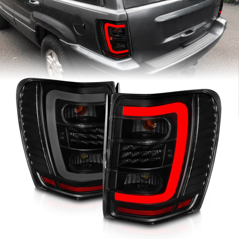 ANZO 1999-2004 Jeep Grand Cherokee LED Tail Lights w/ Light Bar Black Housing Smoke Lens - Burkken Auto Parts