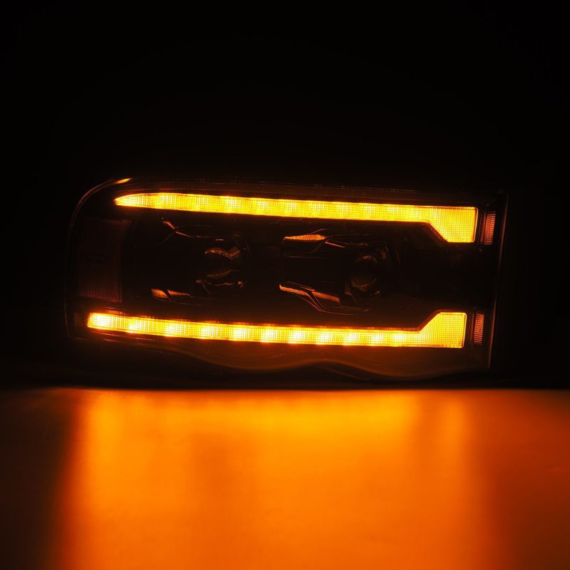 AlphaRex 02-05 Dodge Ram 1500 PRO-Series Projector Headlights Plank Style Alpha Black w/Seq Signal - Burkken Auto Parts