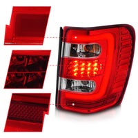 ANZO 1999-2004 Jeep Grand Cherokee LED Tail Lights w/ Light Bar Chrome Housing Red/Clear Lens - Burkken Auto Parts