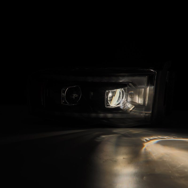 AlphaRex 02-05 Dodge Ram 1500 PRO-Series Projector Headlights Plank Style Black w/Seq Signal - Burkken Auto Parts