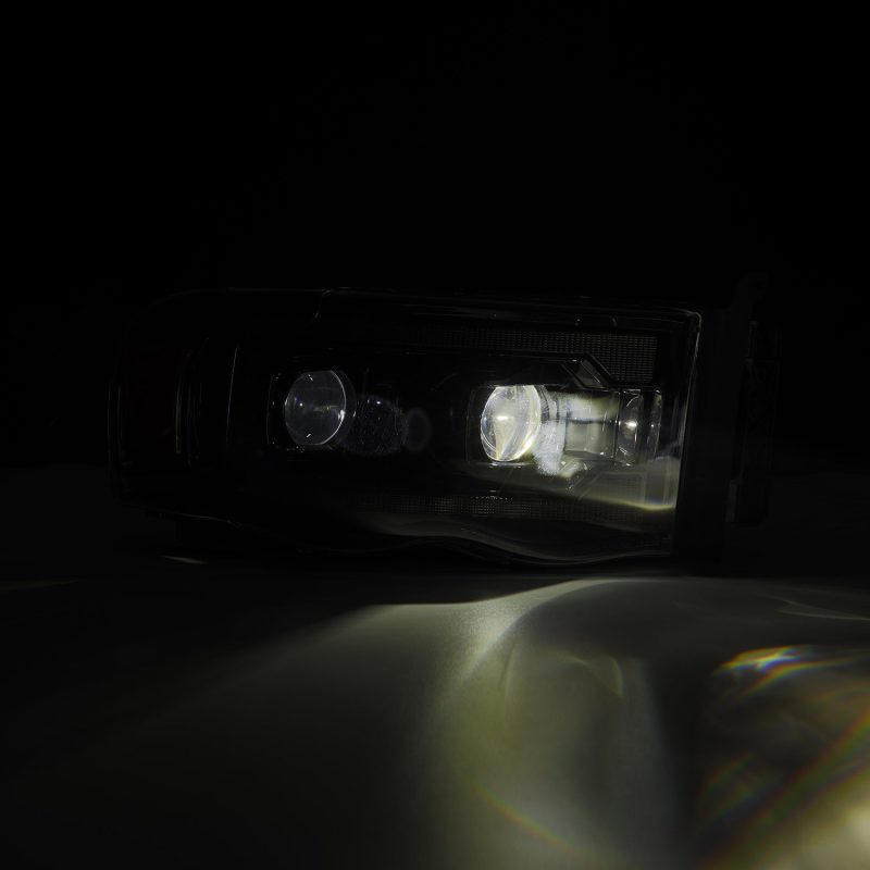 AlphaRex 02-05 Dodge Ram 1500 PRO-Series Projector Headlights Plank Style Alpha Black w/Seq Signal - Burkken Auto Parts