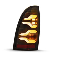 AlphaRex 05-15 Toyota Tacoma LUXX LED Taillights Alpha Blk w/Activ Light/Seq Signal - Burkken Auto Parts