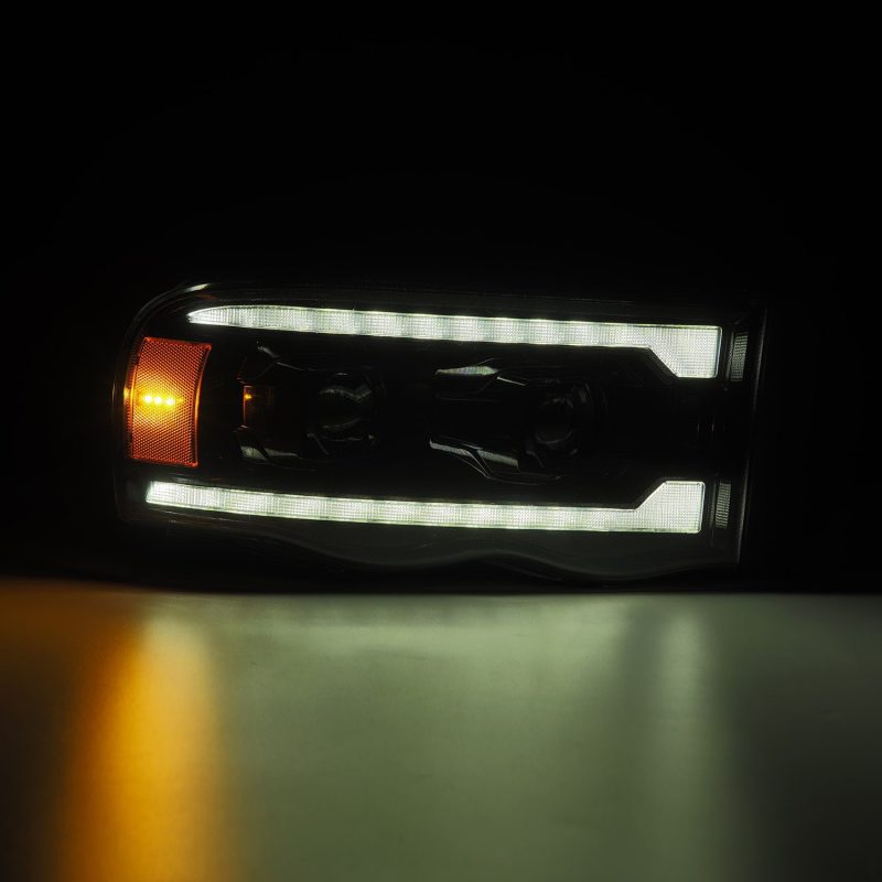 AlphaRex 02-05 Dodge Ram 1500 PRO-Series Projector Headlights Plank Style Alpha Black w/Seq Signal - Burkken Auto Parts