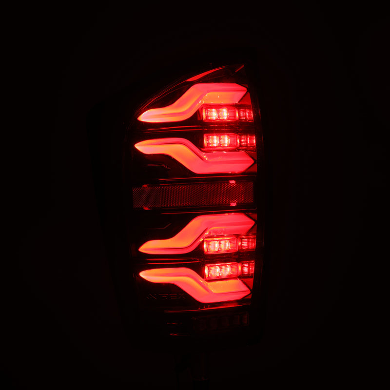 AlphaRex 16-21 Toyota Tacoma LUXX LED Taillights Alpha Blk w/Activ Light/Seq Signal - Burkken Auto Parts