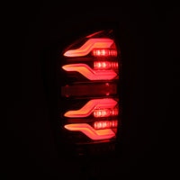 AlphaRex 16-21 Toyota Tacoma LUXX LED Taillights Alpha Blk w/Activ Light/Seq Signal - Burkken Auto Parts