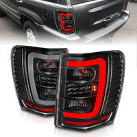 ANZO 1999-2004 Jeep Grand Cherokee LED Tail Lights w/ Light Bar Black Housing Clear Lens - Burkken Auto Parts